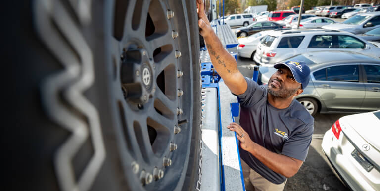 A supplier working with a vehicle.