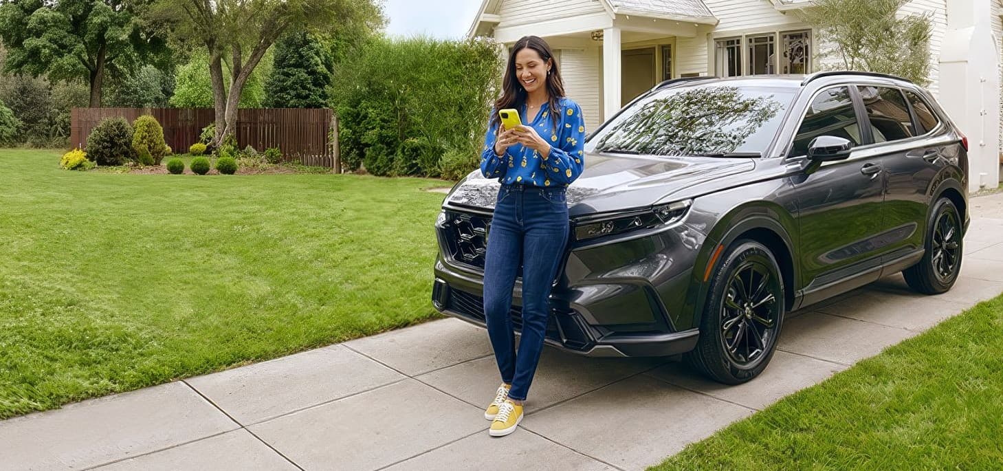 woman sitting on hood of car getting an instant offer
